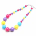 Close-up detail of colorful chunky acrylic bead necklace with silver spacer beads and chain. - Multicolor
