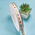 White printed ribbon roll with colorful balloon and text design for gift wrapping decor - 1.5cm x 100 Yards - Just Balloon