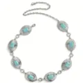 Ceinture chaîne argentée avec boucles ovales texturées turquoise et chaîne réglable. - Chaîne de Taille Anneau Ovale Turquoise / Argent antique