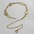 Detailed view of the women gold metal waist chain, featuring bohemian round links and adjustable design. - Hollow Oval Waist Chain / Gold