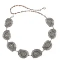 Detail view of the intricate concentric pattern on the metallic silver waist chain medallion. - Special-Shaped Waist Chain / Silver
