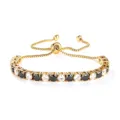 Gold adjustable tennis bracelet with alternating black and clear 4mm cubic zirconia stones. - 4mm Gold Bead White and Black Zirconia