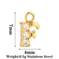 Ciondolo lettera F in acciaio inossidabile con tre zirconi cubici, dimensioni 7x4mm, 0.5g. - Lettera F / Oro