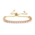 Elegante bracciale tennis in acciaio dorato con zirconi rosa e catenina regolabile. - Colore Oro Pietra Rosa