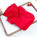 Detail shot of red pet hoodie with hood and ring, cozy dog apparel for small pets. - XS / Red
