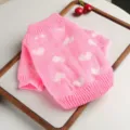 Detailed view of cute pink knit dog sweater with white heart pattern for small pets. - XS-Bust 30cm, Length 20cm (Approx 1-1.5kg) / Pink Heart Charm