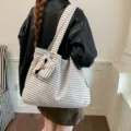 Detail view of retro striped canvas tote bag with small pouch, casual everyday shoulder bag. - Mini Pouch Pendant Style / 40x6x32cm / White Thin Stripes
