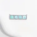 Close up detail of silver copper cubic zirconia square pendant jewelry DIY part. - Lake Green Square Grid Pendant / White Gold