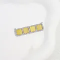 Detailed view of a rectangular brass pendant with cubic zirconia and yellow grid stones. - Yellow Square Grid Pendant / White Gold