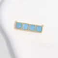 Gold-toned brass connector pendant featuring four blue square insets and sparkling cubic zirconia. - Sky Blue Square Grid Pendant / Gold