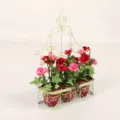 Metal wall hanging flower basket with artificial red and pink roses, rustic home decor pot. - Red