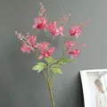 Artificial pink bamboo flower branch for home decor, wedding, and indoor decoration use. - Pink