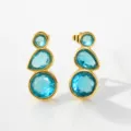 Close up detail of triple blue stone drop earrings with gold plated metal setting. - Gold Style 2