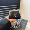 Black mini kiss lock shoulder bag with silver crescent moon charm and bead chain strap. - Crescent Moon / Black