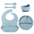 Detailed view of silicone baby feeding set including divided suction plate, bowl, bib, spoon, fork. - Silicone Fork And Spoon 5-Piece Set / Light Blue