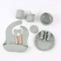 Silicone baby feeding set detail view, featuring divided plate, bib, bowl, cup and utensils. - Army Green 10-Piece Round Plate Set