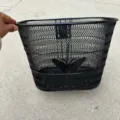Black metal mesh bicycle basket front mount with cute butterfly decor for bike storage. - Bicycle Basket