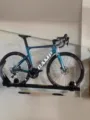 Wall mounted bicycle display rack for home garage or bike shop storage and parking solution - Black