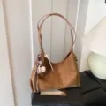 Brown vintage suede shoulder bag for women, large capacity minimalist chic hobo bag with charm. - Brown
