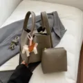 Korean style PU leather bucket bag set with pouch and cute winged horse charm for women. - Gray