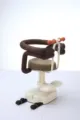 Details of child front bike seat featuring adjustable height stem, mesh safety rail, and footrest. - Front Seat / Style 2