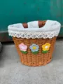Close-up details of the woven bicycle basket featuring cute crochet flowers and lace lining. - With Lining / Brown