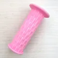 Pink woven kids bike handlebar grip detail, soft rubber bicycle accessory close up view. - Pink