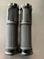 Black bicycle handlebar grips with aluminum alloy and rubber non-slip texture detail. - One Size / Black