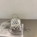 Silver metallic quilted mini backpack with chain straps and stylish front turn-lock. - Silver