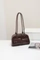 Detail view of the dark brown women's shoulder underarm bag with double slim straps. - Coffee