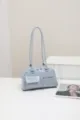Chic light blue shoulder bag for women, retro minimalist design with front pockets for daily commute. - Blue
