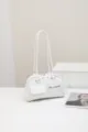 White shoulder bag detail, elegant underarm bag with double straps and front pockets. - White