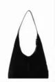 Detailed view of the black suede hobo shoulder bag, featuring a soft texture and spacious design. - Black