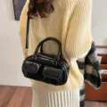 Black patent leather bowling shoulder bag retro PU handbag with front pockets style. - Black