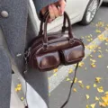 Retro brown glossy PU leather bowling handbag with double front pockets and shoulder strap. - Coffee