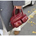 Retro PU leather bowling shoulder bag for women, stylish dark red handbag with dual pockets. - Burgundy