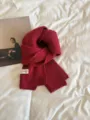 Cozy red knitted winter scarf, soft texture, classic solid color design for daily warmth. - Christmas Red