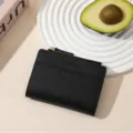 Black minimalist short women wallet with zipper coin pocket and card slots for daily use. - Black