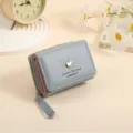 Cute women's short wallet with heart charm and zipper coin pocket for daily casual use. - Light Blue
