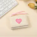 Short trifold wallet with pink lanyard and heart badge, minimalist cute style for women. - Off White