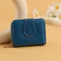 Stylish blue women's short wallet with secure zipper and flap closure, multiple card slots. - Blue