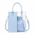 Transparent PVC tote bag detail view featuring matching blue PU leather inner drawstring pouch. - Blue
