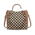 Black and white checkerboard canvas handbag with brown leather trim and crossbody strap. - Brown