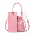 Clear PVC tote bag detail showing pink PU leather panel and inner drawstring pouch. - Pink