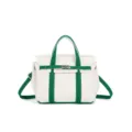 Canvas handbag detail, green and white contrast, top handle, adjustable strap, daily use. - White & Green
