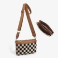 Detailed view of canvas checkerboard crossbody bag showing multi zipper pockets and wide strap. - Checkerboard Brown