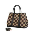 Detailed view of brown checkerboard canvas tote bag with black handles and strap hardware. - Black