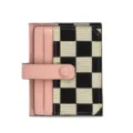 Mini card holder wallet with checkerboard canvas and pink leather slots for daily use detail. - Pink
