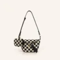 Close-up detail of the black white checkerboard canvas crossbody bag with mini pouch. - Small Checkerboard Black