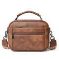 Brown PU leather crossbody bag with top handle, dual front zippers and stylish strap. - Brown